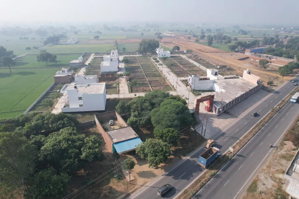 Aerial view of Shiv Shakti Vihar beside the highway and farmland