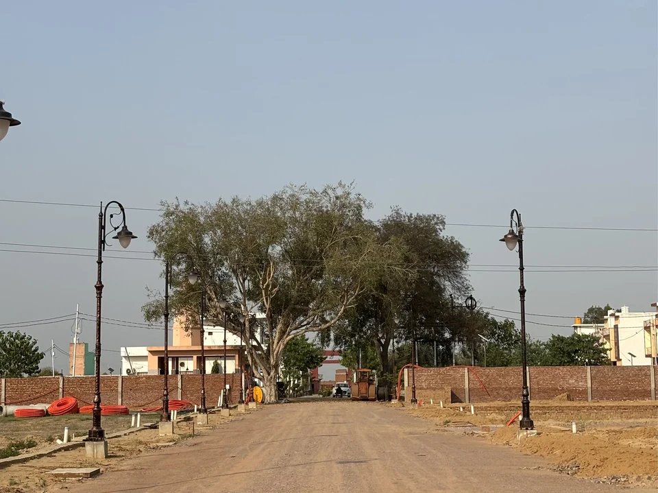 An internal road with street lamps at Shiv Shakti Vihar Phase 2